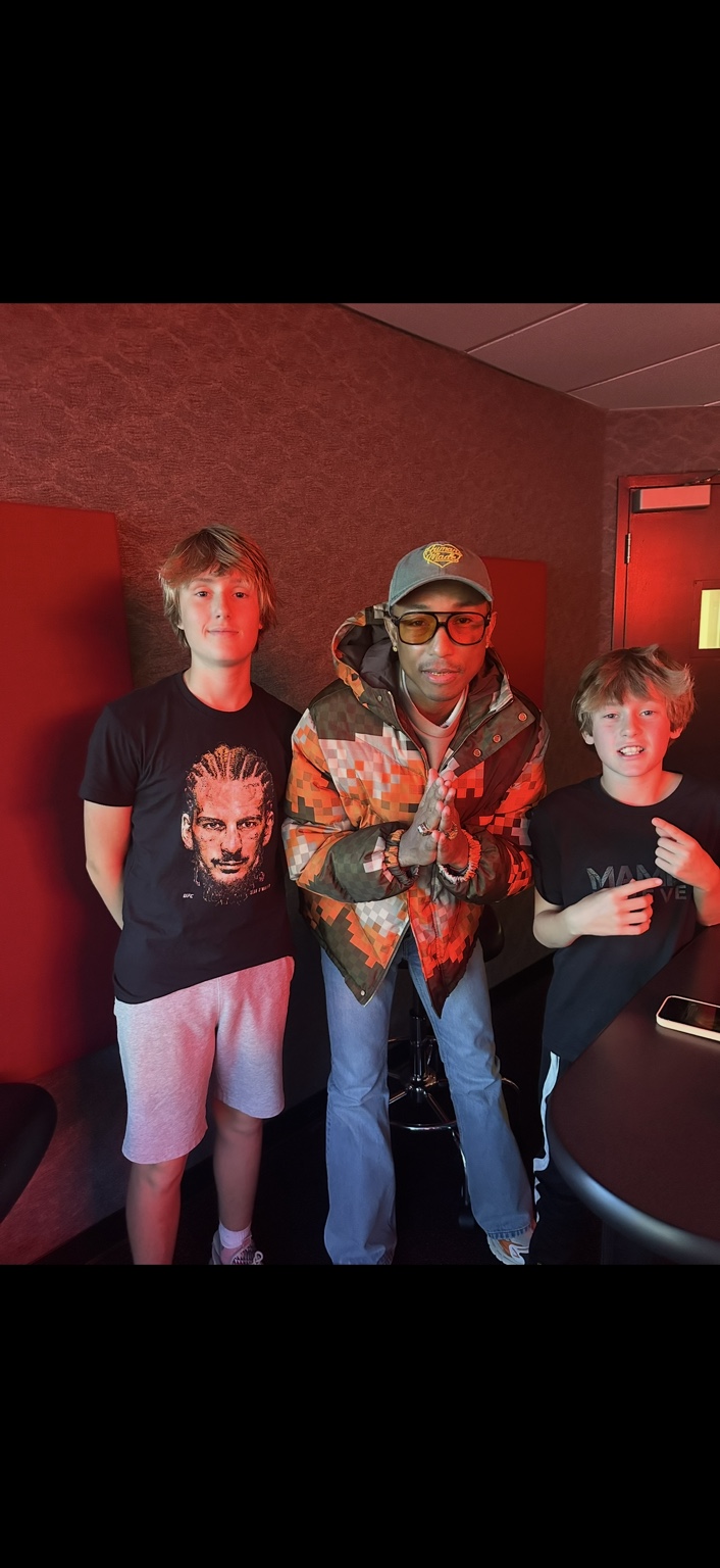 Pharrell Williams with Brandon Shaggy Stokes’ sons Brody and Bentley during his October 2024 studio visit