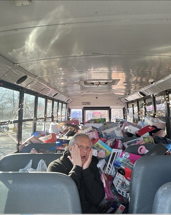 A school bus filled from front to back with donated toys