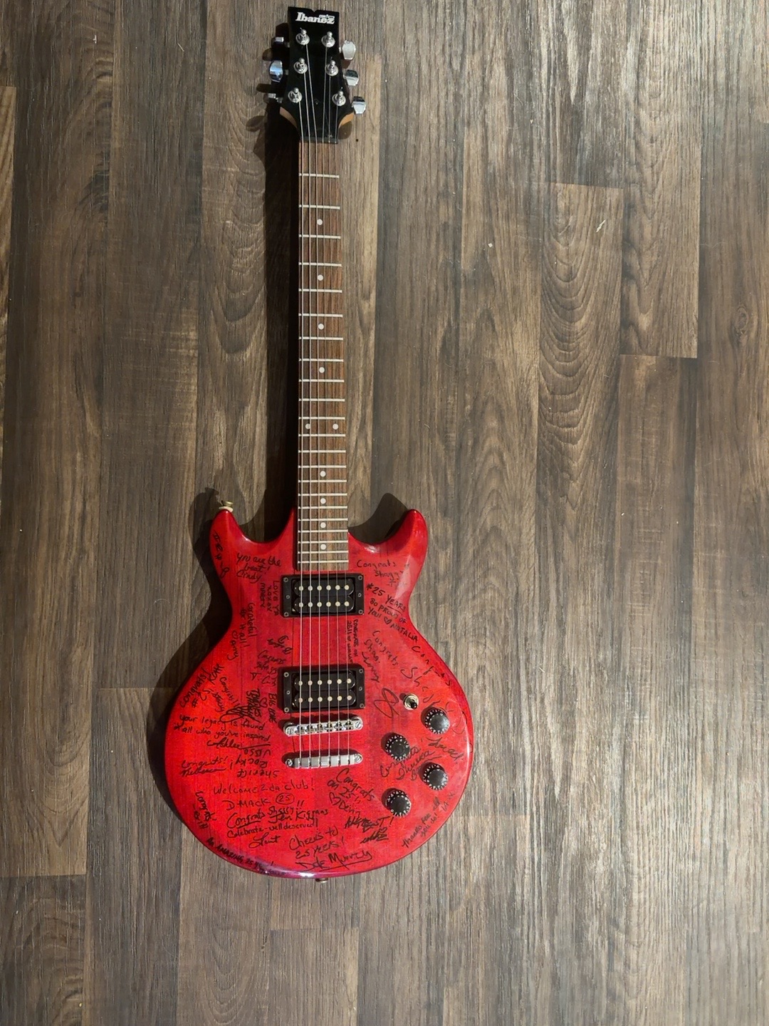 Twenty-five years of radio: A guitar signed to celebrate the milestone