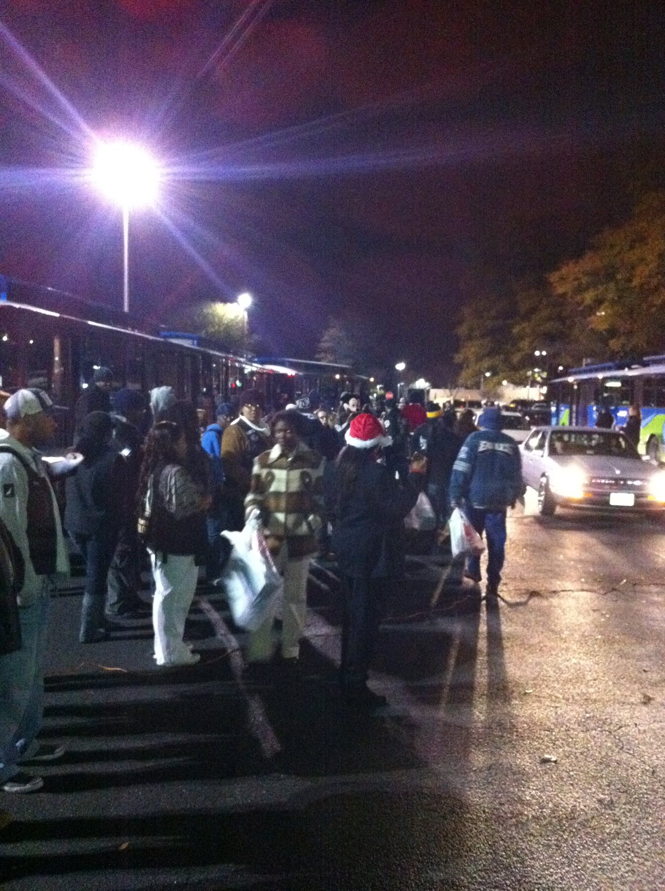 A large community crowd gathered outside during Stuff the Bus in 2010