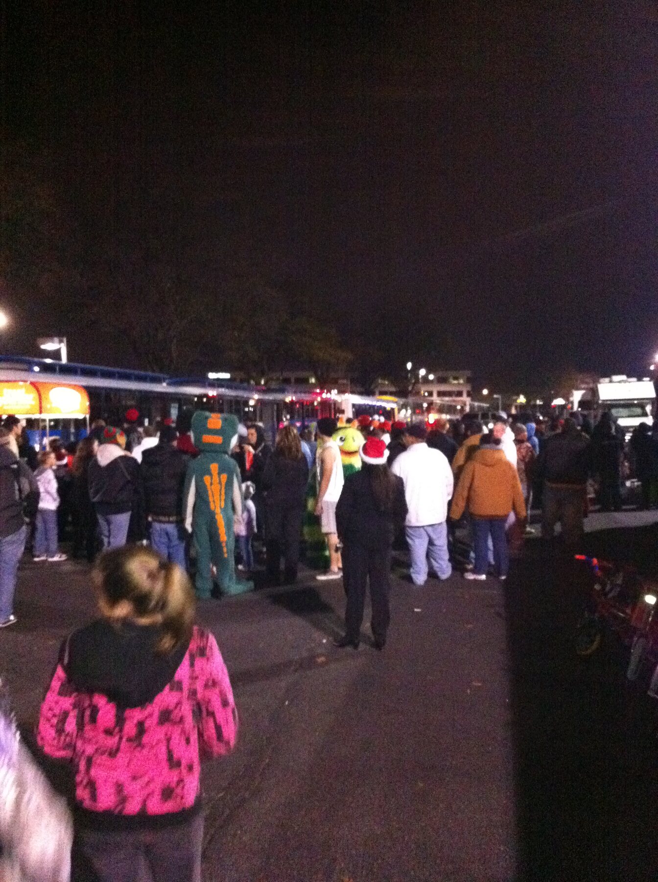 Families gathered near the Stuff the Bus collection area at night in 2010