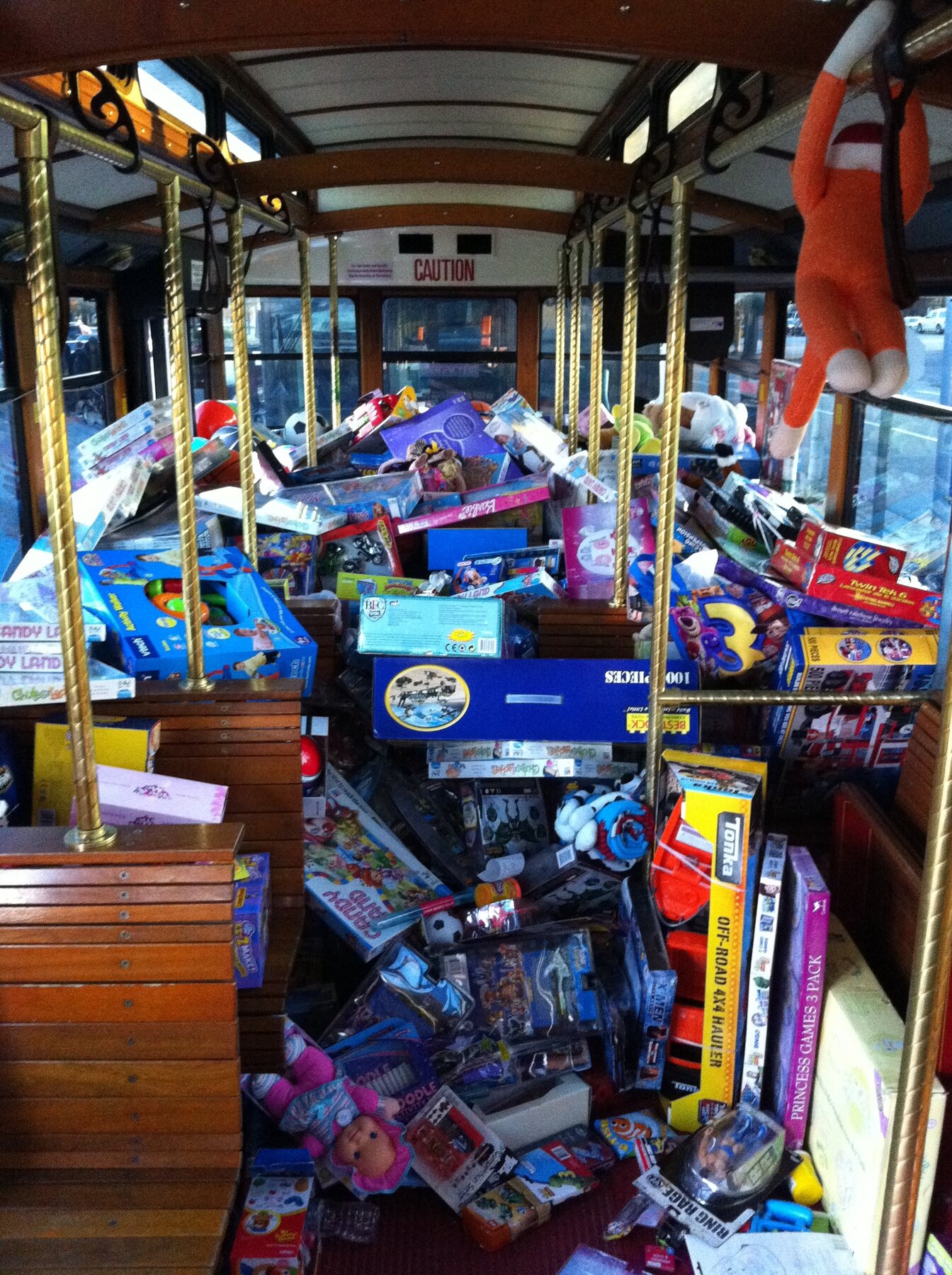 Donated toys overflowing through the Stuff the Bus bus in 2010