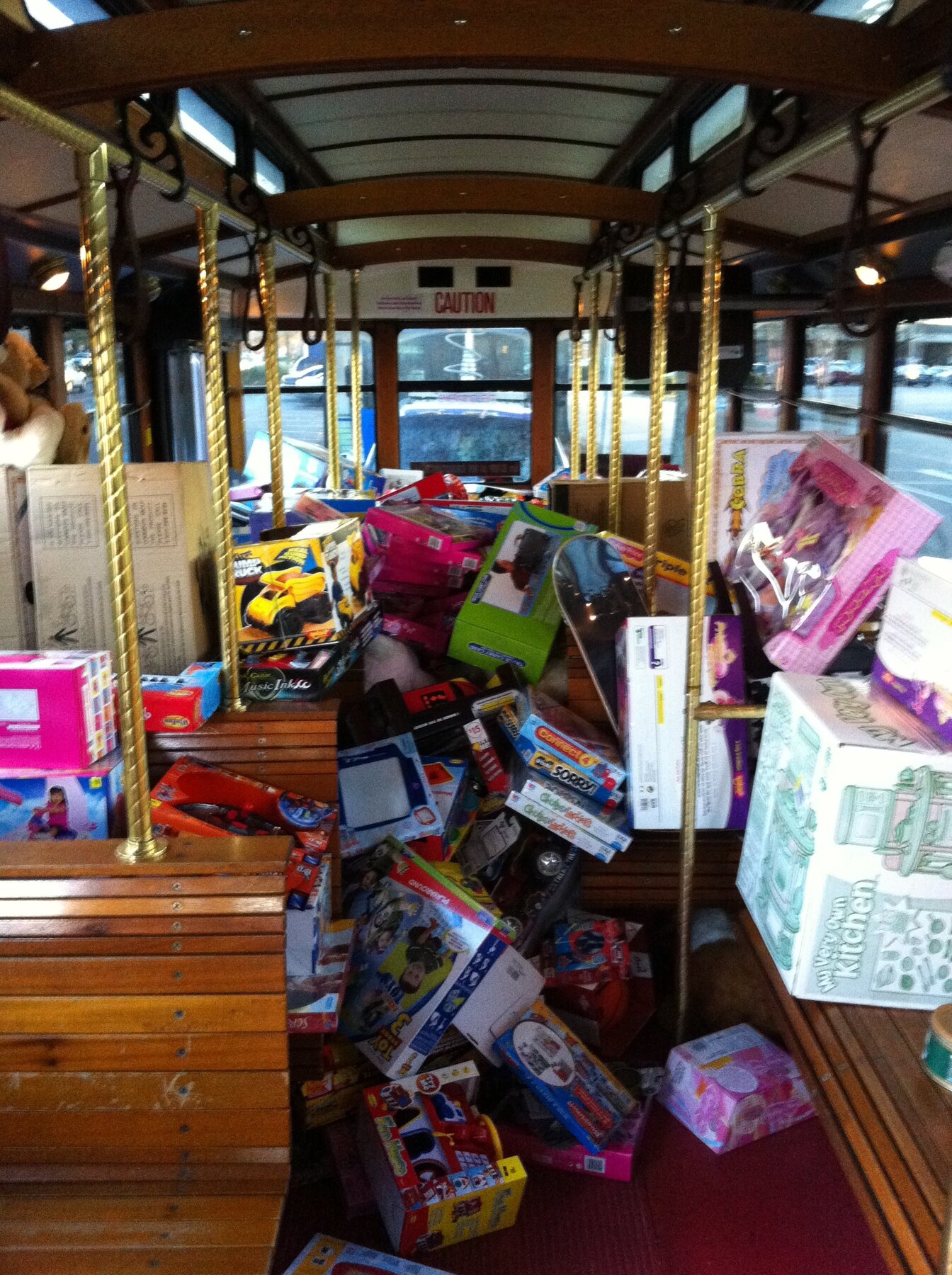 Boxes of donated toys stacked throughout the Stuff the Bus bus in 2010