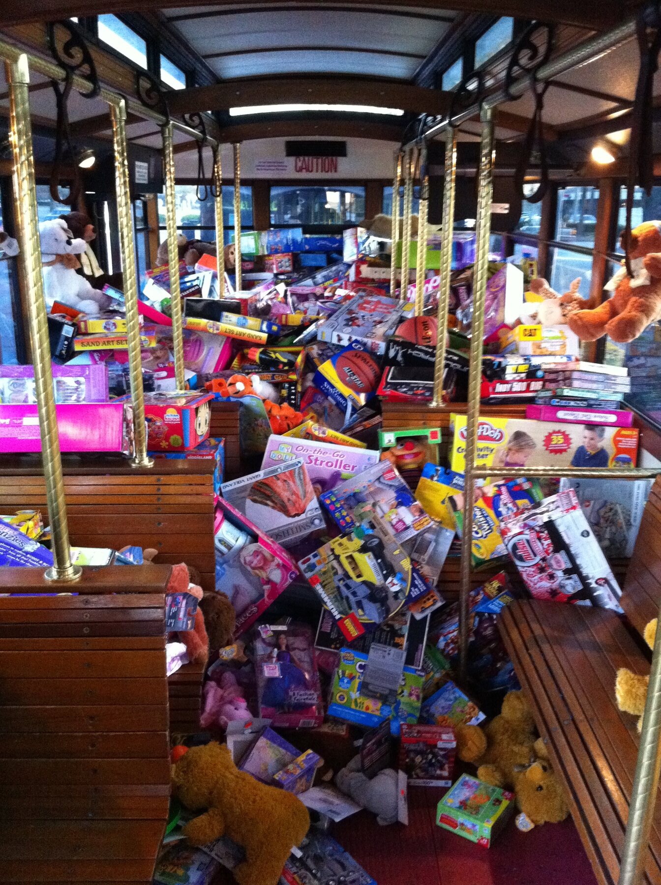 A large pile of donated toys inside the Stuff the Bus bus in 2010