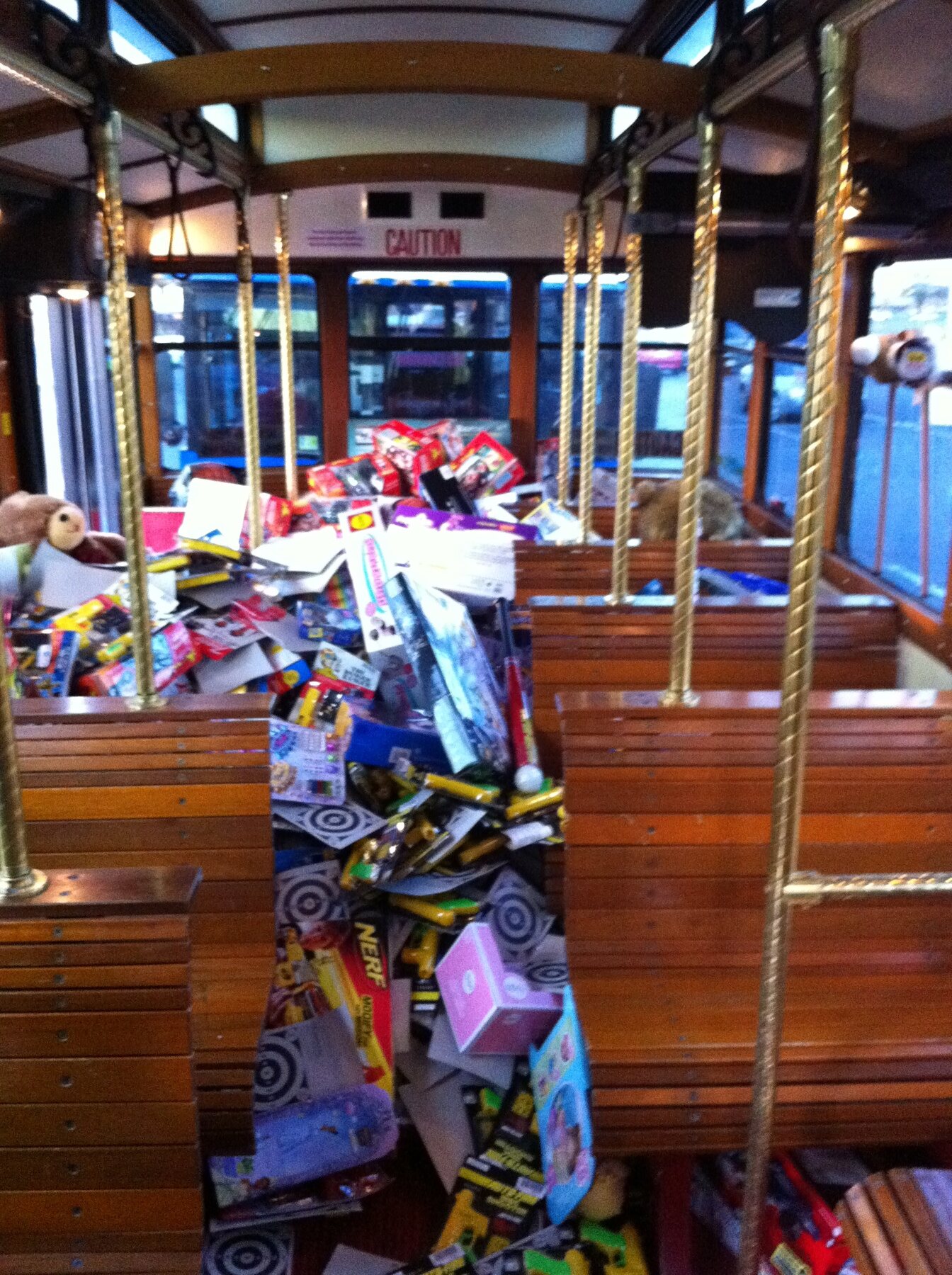 Nerf toys, dolls and boxes stacked inside the Stuff the Bus bus in 2010